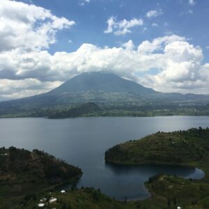 Beautiful landscape of a lake with mountains under a cloudy sky in Butaro, Rwanda. kwesttzadventures rwanda