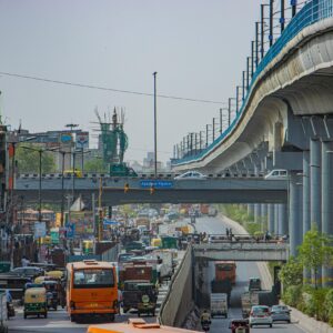 View of a busy road in Delhi featuring the Azadpur Flyover and local traffic. kwesttzsadventures delhi