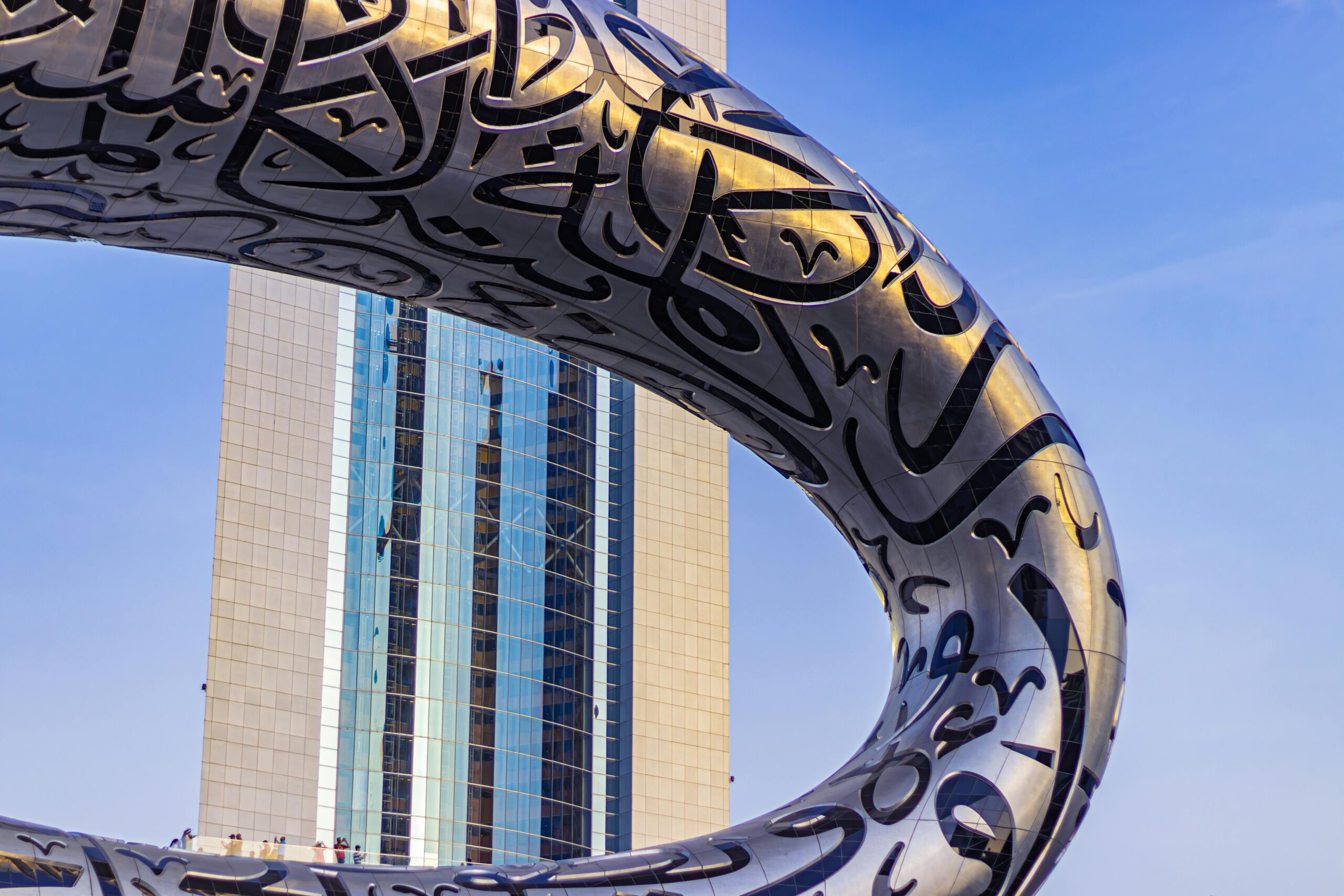 Stunning view of Dubai's iconic Museum of the Future against a blue sky. kali travels