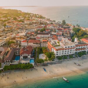 A breathtaking aerial shot of Stone Town, Zanzibar featuring historic architecture and scenic coastline. kwesttadventures