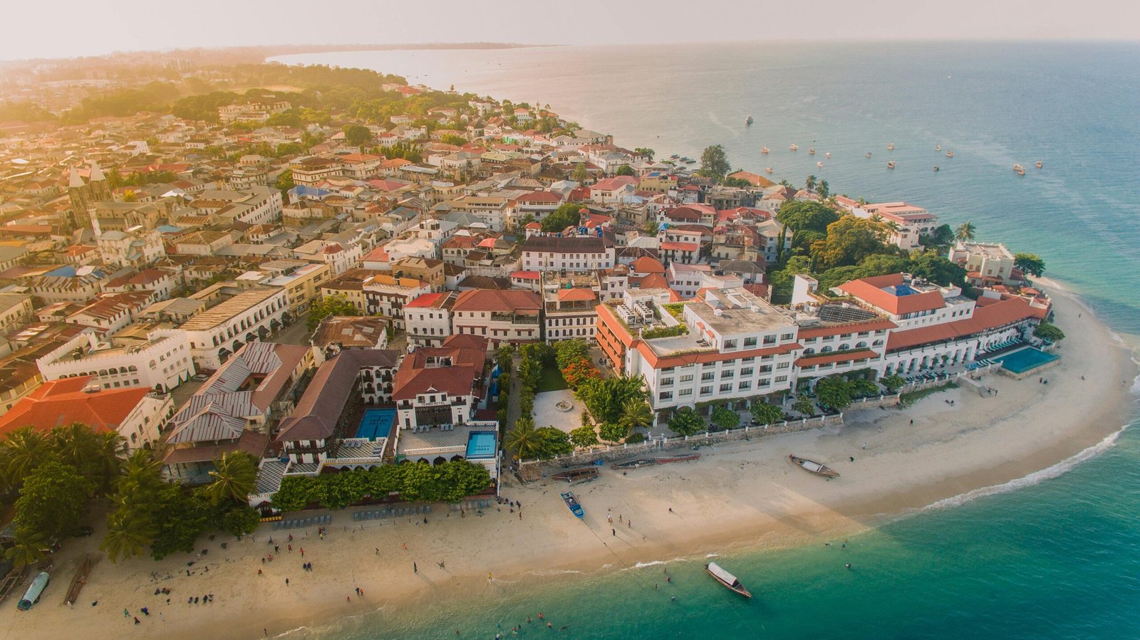 A breathtaking aerial shot of Stone Town, Zanzibar featuring historic architecture and scenic coastline. kwesttadventures