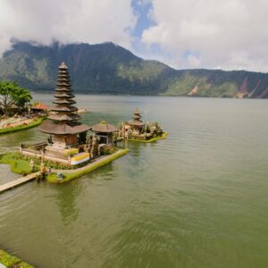 A stunning aerial view of Pura Ulun Danu Bratan Temple situated by a serene lake in the highlands of Bali, Indonesia. kwesttzadventures Bali